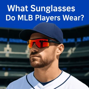 The image shows a close-up of a professional MLB player wearing sports sunglasses with red-orange mirrored lenses. He is dressed in a white jersey and navy cap, standing in front of a blurred, empty stadium. The text above reads, "What Sunglasses Do MLB Players Wear?" in white on a blue background.